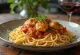 Качатора с пастой, томатным соусом, куриной ножкой и оливками
